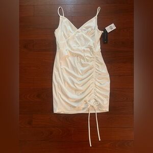Women’s White Ruched Mini Dress. Size Large. Built in slip for extra coverage.